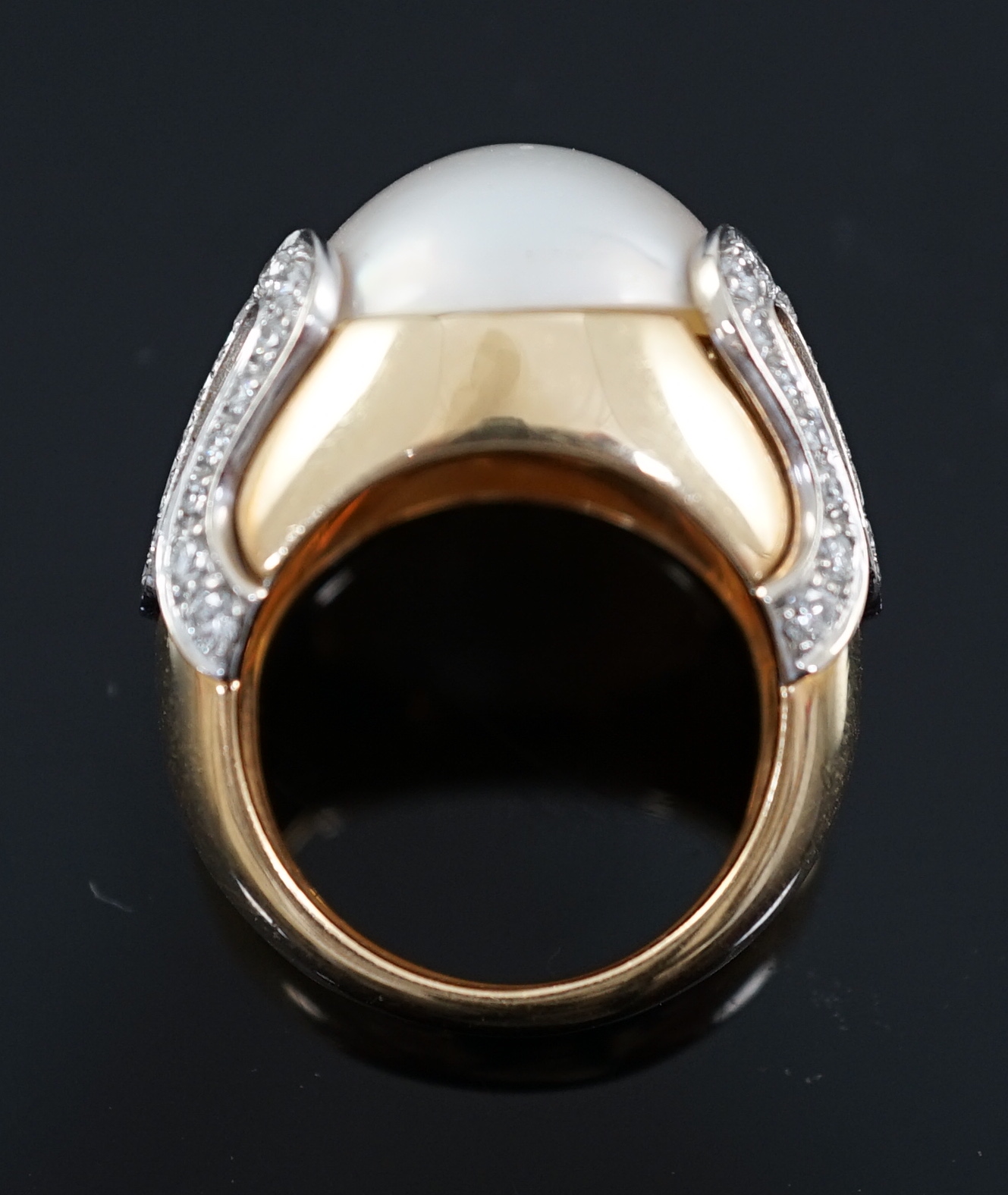 A modern Italian Versace 18ct gold and half cultured pearl set dress ring, with round brilliant cut diamond set shoulders